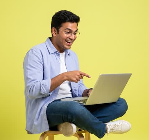 Creator pointing at his laptop